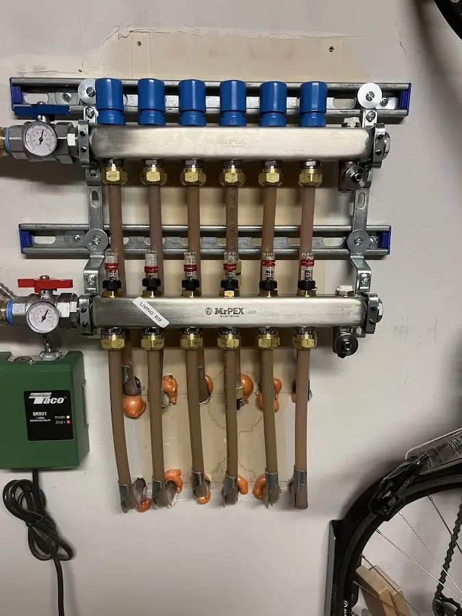 Plumber performing Water Heater Repair at a residential property in Milton